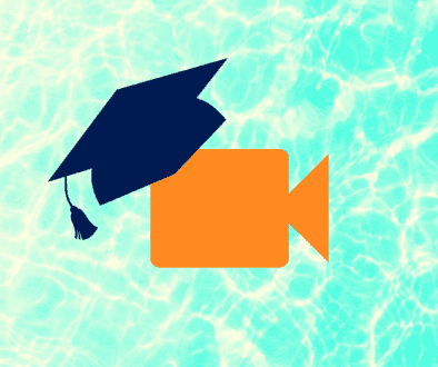 orange video camera with a blue graduation cap on top of it over a blue water background