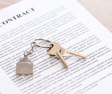 Contract and keys on a house key ring signifying a home rental opportunity.