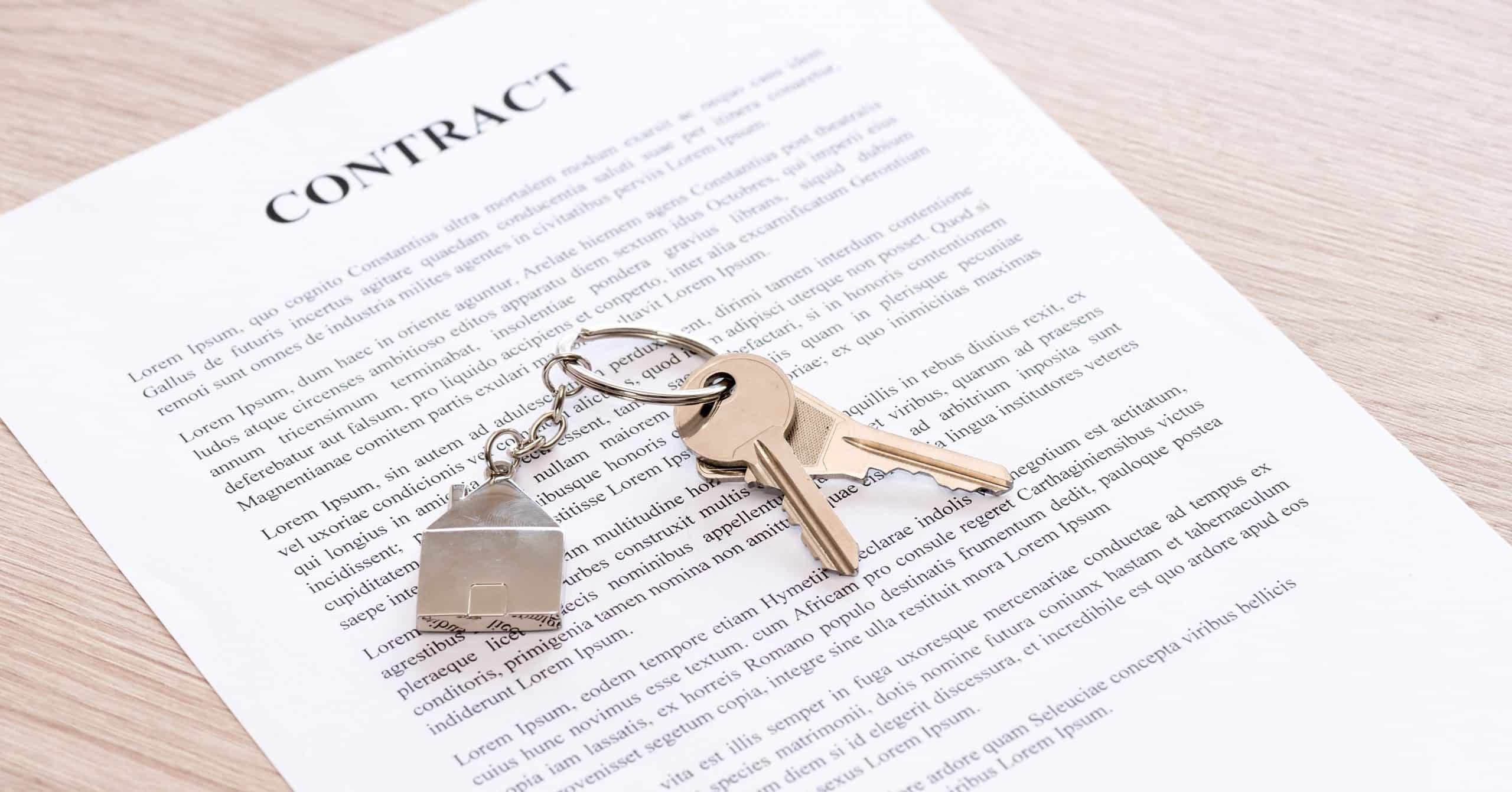 Contract and keys on a house key ring signifying a home rental opportunity.