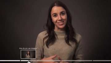 image of a woman smiling with a row of shaded sections at the bottom of a video; a pointer mouse is hovering over one titled "How do you use chapters?"